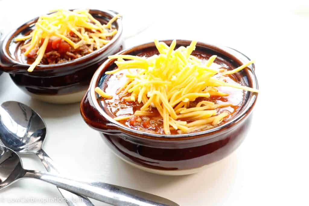 bowl of keto chili topped with cheese
