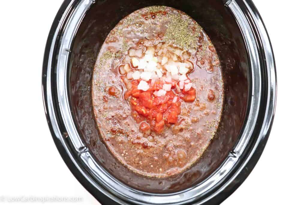 Keto Chili Recipe ingredients in a slow cooker bowl